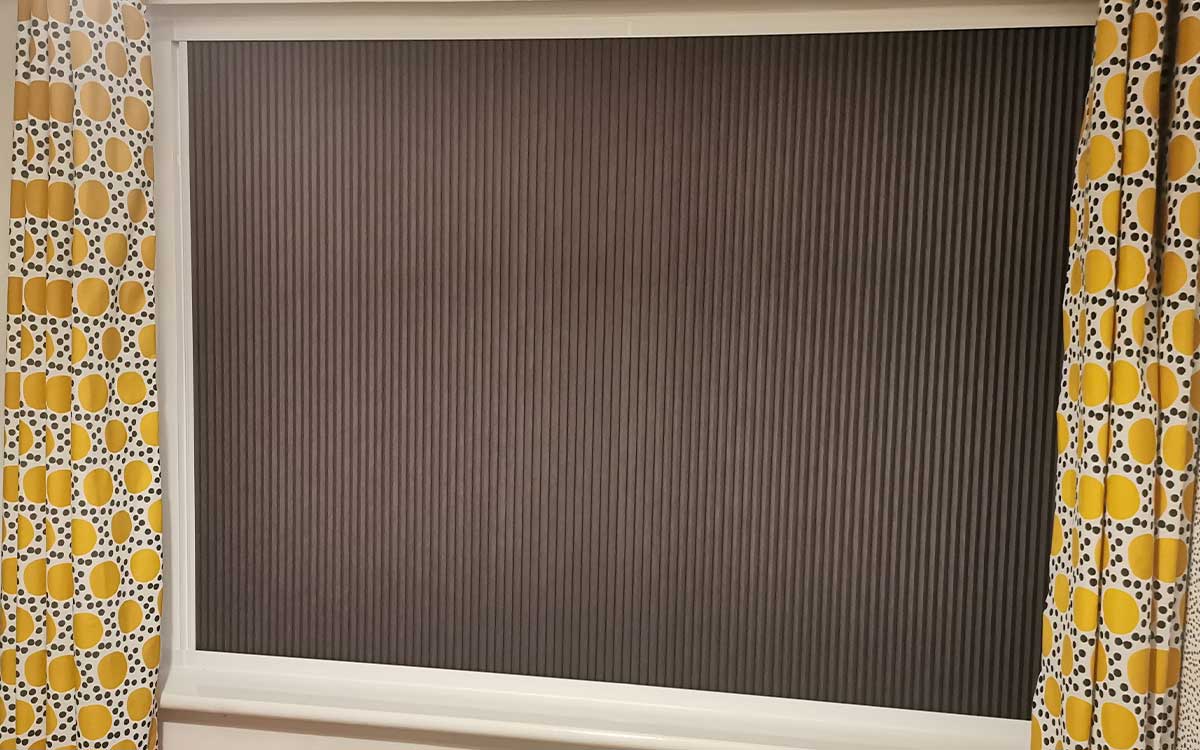 Nightshade blackout blind fitted in a bedroom