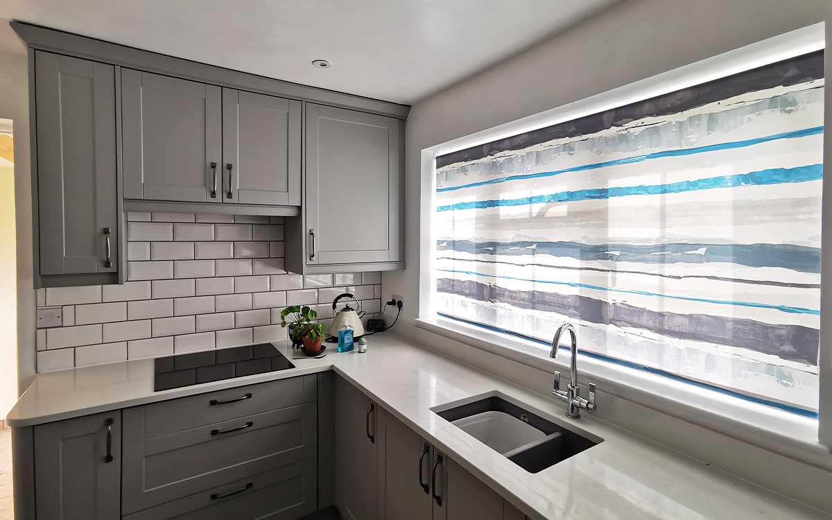 Roller blinds installed in a bedroom