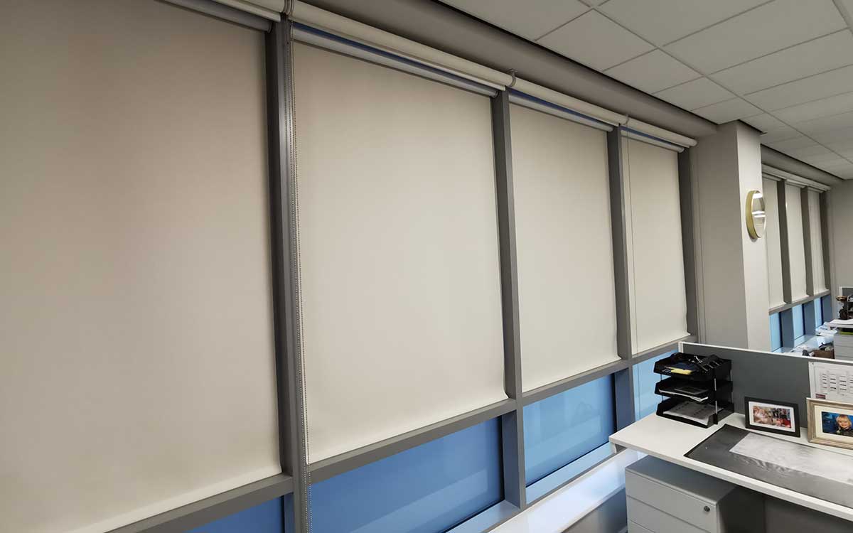 Blackout roller blind fitted in a bedroom