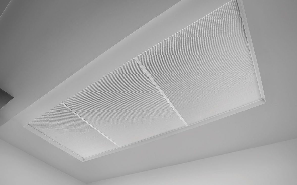 Two skylight blinds closed across a large roof lantern