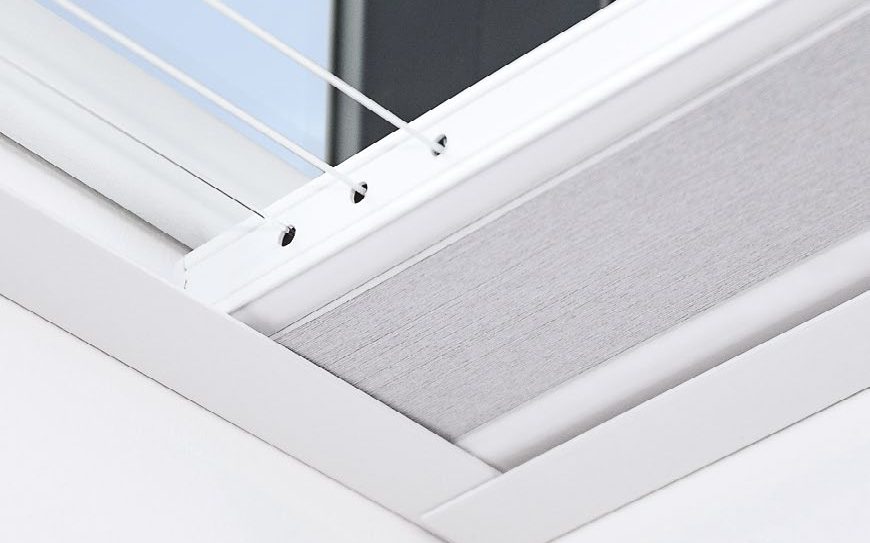 Close-up of a skylight blind headrail and side trim