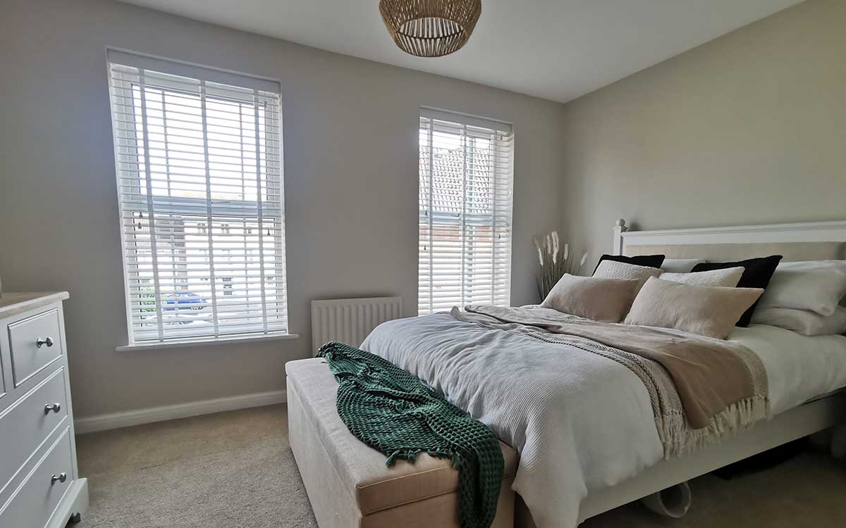 Wooden blinds fitted on a bay window