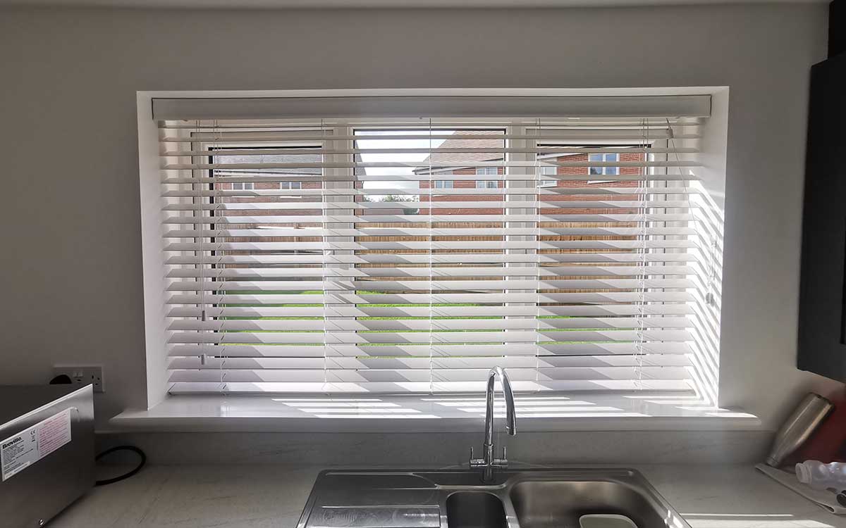 Faux wood blinds in a bedroom